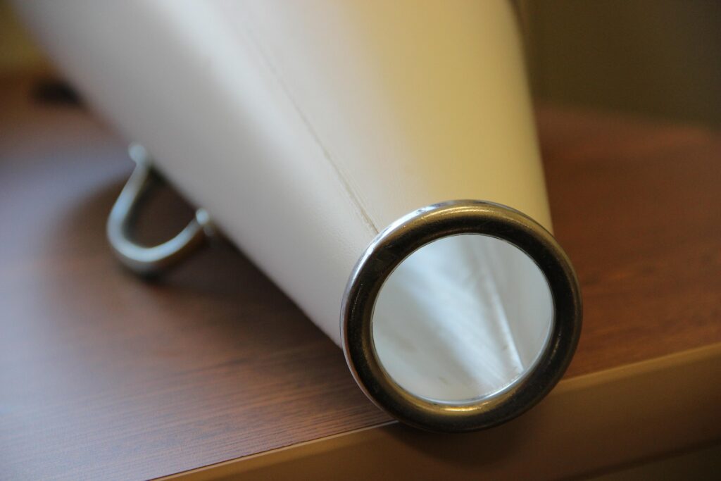 White megaphone resting on a wooden table